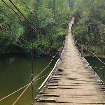 Suspension bridge over Mae Chan river at Mae Chan Tha Village, Tak